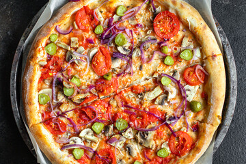 pizza vegetables tomato, onion, pickles, mushrooms, etc. vegan or vegetarian food ready to eat portion on the table for healthy meal snack outdoor top view copy space food background rustic 