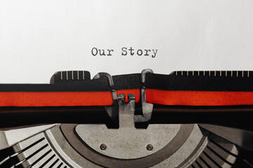 Text Our Story typed on retro typewriter