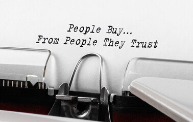 Text People Buy From People They Trust typed on retro typewriter
