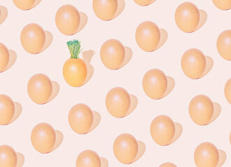 Creative Easter pattern of eggs and carrots. A simple, minimal idea for Easter with a pastel tone.