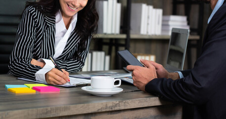 Fototapeta premium young caucasian businesswoman discuss with colleagues about profit of corporate in office. business concept