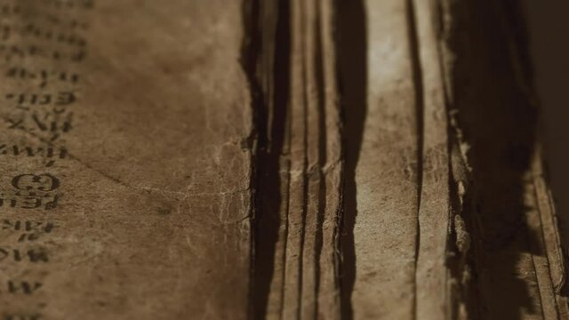 Old yellowed antique book close-up. Treasures of past. Museum piece from library. Orthodox psalter, 19th century, prayers and psalms. 4k