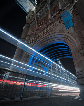 Time-lapse photo of cars' light in Tower Bridge in London during nighttime