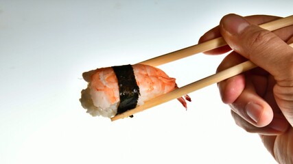 Ebi nigiri sushi with shrimp cooked in bamboo sticks