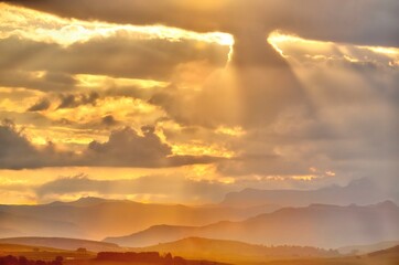 SUNBEAMS AND CLOUD  IN THE DRAKENSBERG, kwazulu natal, south africa 