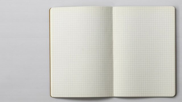 4k-Stop motion graph book animation open blank page for writing on white background.
