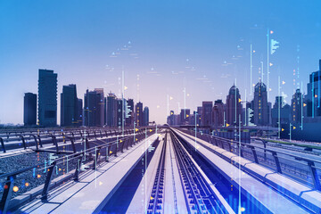 The way towards skyscrapers by modern futuristic train. Tech railway delivers commuters to the financial downtown of Dubai. International business hub. Traffic concept. FOREX graph. Double exposure
