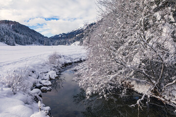 wintry river in the alps