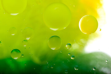 Oil drops on a water surface. Abstract and background.