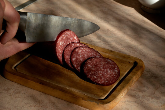 Sliced ​​kalbasa on a board.
