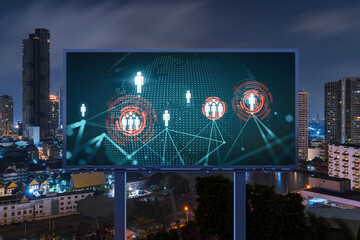 World planet Earth map hologram and social media icons on billboard over night panoramic city view of Bangkok, Southeast Asia. Networking and establishing new connections between people. Globe