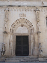 Fototapeta na wymiar The lion portal of the Church of St. Jacob in Sibenik, Croatia, shows a representation of Adam and Eve