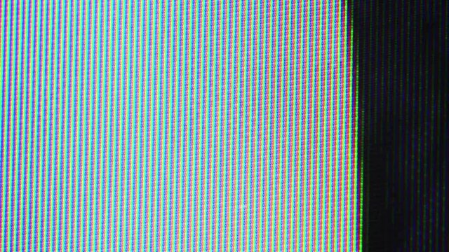 Close up view at a plasma tv while showing television activity.
