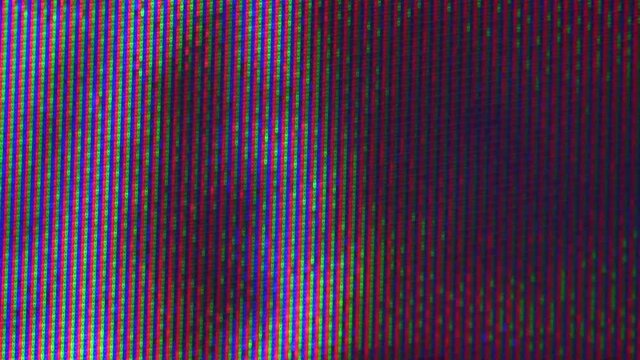 Close up view at a plasma tv while showing television activity.