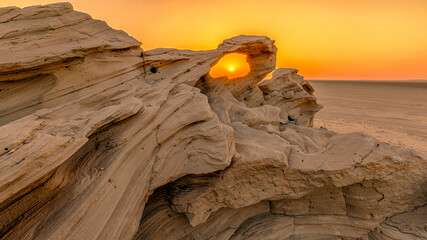 Brown rock formation during sunset