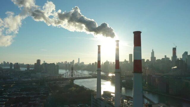 alt late afternoon flying clockwise around smoking LIC power plant