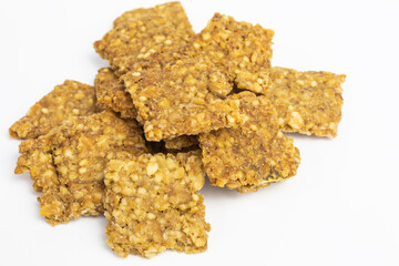 heap of crispy cracker with different cereal flakes wheat, oat, barley, rye and rice and black truffle - tuber aestivum