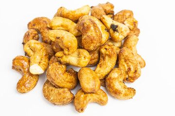 heap of roasted cashew nuts with black truffle - tuber aestivum