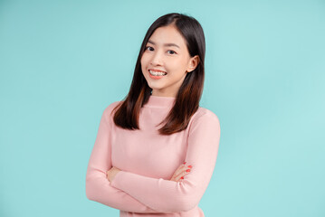 Dental braces of young asian woman wearing retainer braces glad emotion with white teeth increase confidence for healthy on blue background isolated, Happiness teenager smiling facial expression.