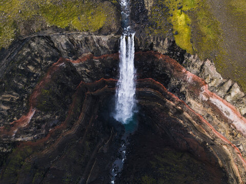 Waterfalls on brown rocky mountain