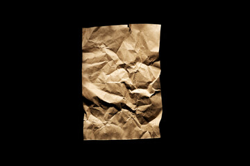 Old brown vintage paper isolated on black background.