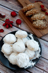 Greek Christmas cookies kourabiedes with almonds powered with white sugar