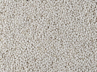 Sesame seeds background and texture, top view