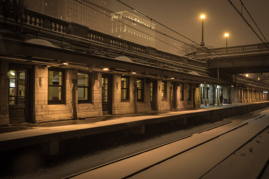 Beautiful vintage train station with dramatic lighting in the snow on overcast night in urban Chicago - Powered by Adobe