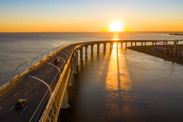 High-speed toll road, highway bypassing the city center St. Petersburg, the central section of the western high-speed section. A beautiful view of the sunset over the Gulf of Finland