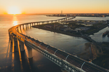 High-speed toll road, highway bypassing the city center St. Petersburg, the central section of the western high-speed section. A beautiful view of the sunset over the Gulf of Finland