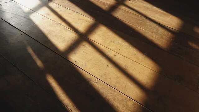 timelapse of sunshine through windows with shadows on wooden floor old