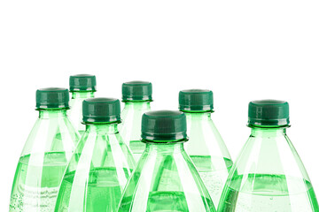 Top of plastic bottles with mineral water on a white background.