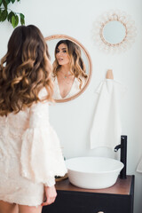 beautiful woman prepare party, preen and look mirror in bathroom