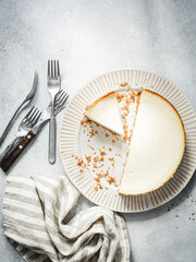 New york cheesecake on concrete background, top view. Sliced cake
