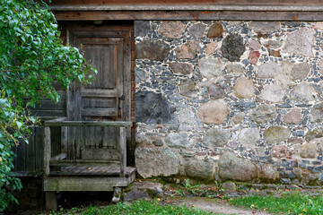 Wooden door with porch.