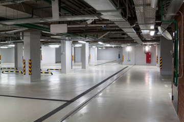 Empty parking garage underground interior in apartment or in supermarket