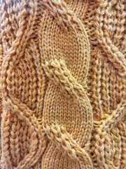 background and texture of woolen knitted fabric. sweater pattern.