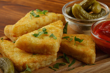 Potato triangular hash brown with cucumbers and tomato sause
