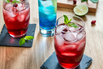 Red and blue delicious cocktails in bar