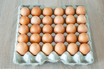 View from above on a box with 30 fresh eggs