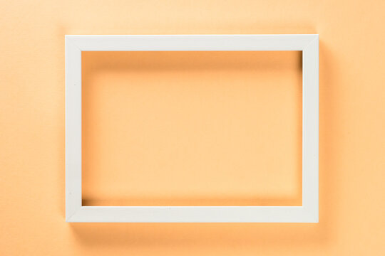 Photo frame at pastel background. Free space for design.