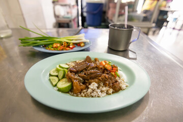 Beef stew served with rice; delicious street food in Thailand.