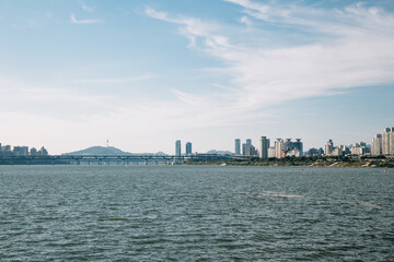 Fototapeta premium Modern buildings and river at Jamsil Hangang park in Seoul, korea
