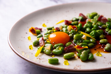 Green beans with iberico ham and cured egg yolk
