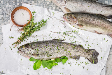 Preparing fresh whole trout for grilling in summer