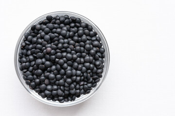Uncooked Black Lentils in a Bowl