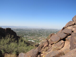 Lookout view on Camelback Mountain with towns and cities in the background on a summer day in...