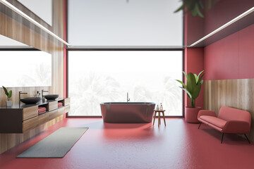 Wooden and red bathroom with black bathtub, sofa and window