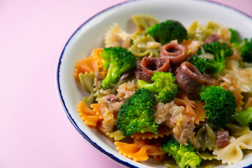 Colored pasta with broccoli and anchovies 