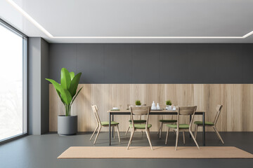 Grey and wooden dining room with chairs and table, plant in the corner